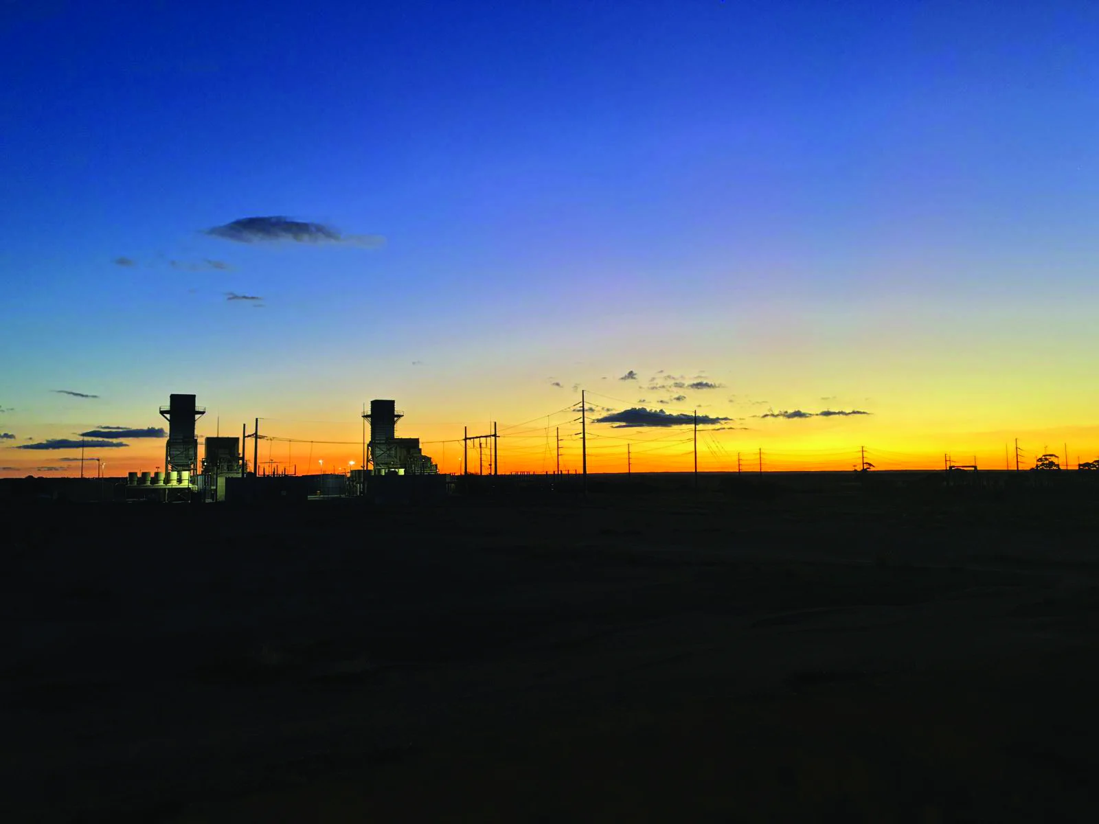 High-voltage site at sunset